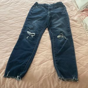 These jeans are ripped at the knees but do have patches